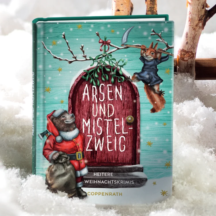 Weihnachtlich gestaltetes Buch steckt in Kunstschnee.